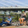 Photo of people riding multiple adaptive bikes