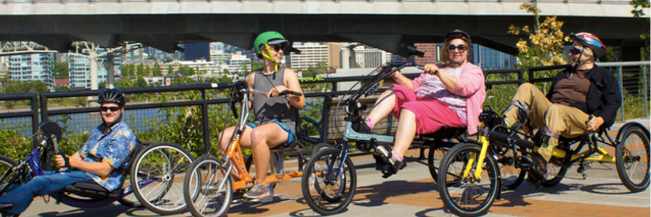 Portland Launches Accessible Bike-Share Program, Adaptive Biketown Photo of people riding multiple adaptive bikes