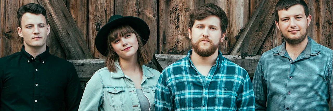 When You Work in the Music Industry and Struggle With Mental Illness four band members standing together