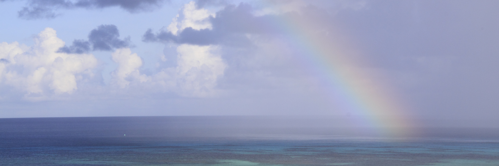 rainbow over the ocean after a storm