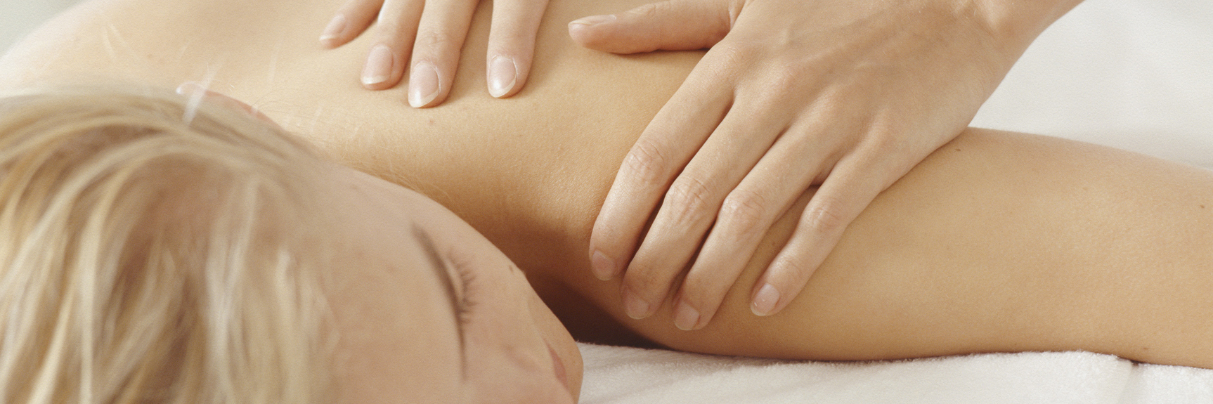 Getting a Sports Massage for Back Pain and Fibromyalgia woman getting a back massage