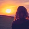 Woman watching sunset