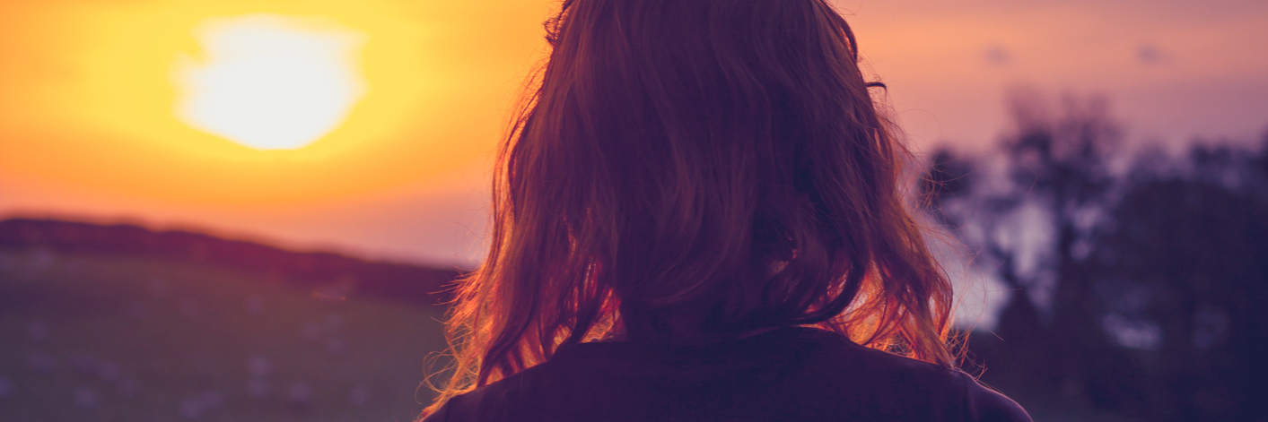 What Losing a Parent Taught Me About Myself Woman watching sunset