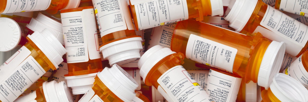 4 Ways to Plan for Changing Psychiatric Medication Dozens of prescription medicine bottles in a jumble.