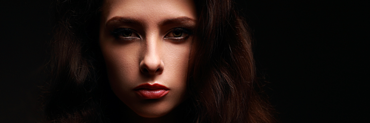 What My Life Is Like With Autonomic Dysfunction A young woman looking seriously into the camera.