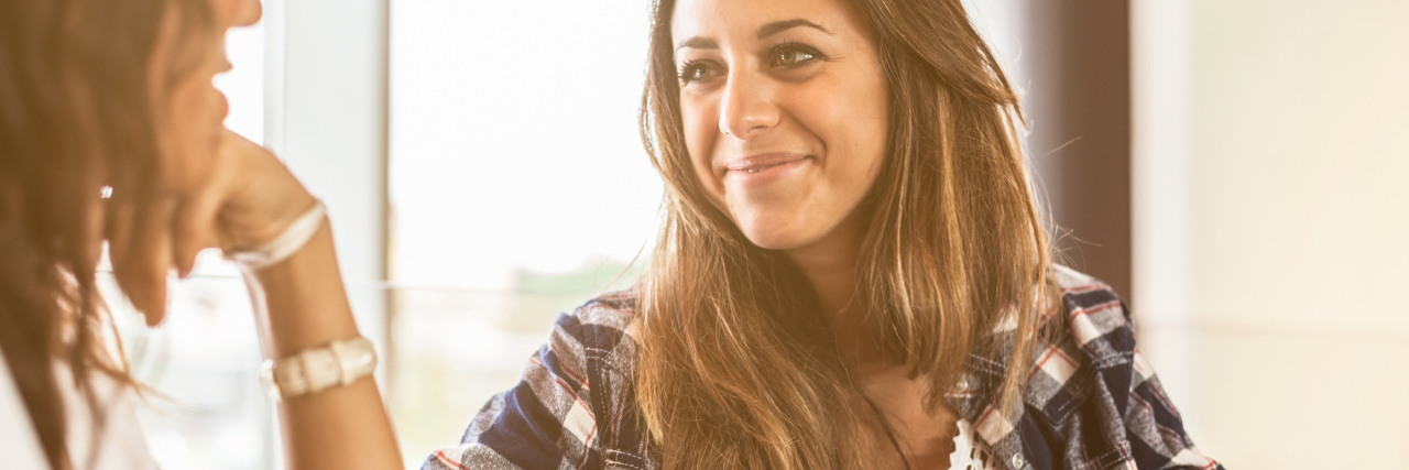 How to Build and Deepen Satisfying Relationships two young women talking at coffee shop or bar