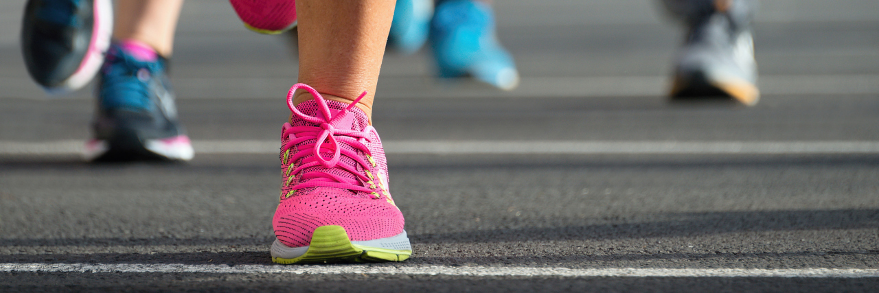 Marathon running race, people feet on city road