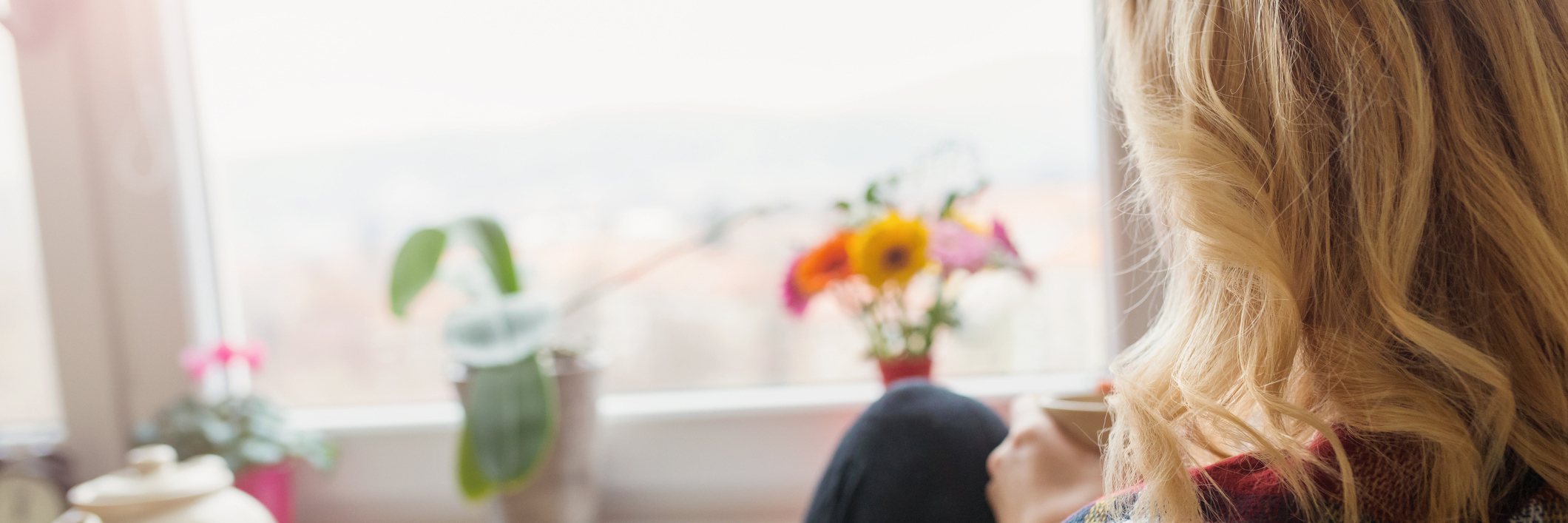 Experiencing Pain and Stiffness in the Morning Due to Lupus woman relaxing at home in the morning with a cup of coffee