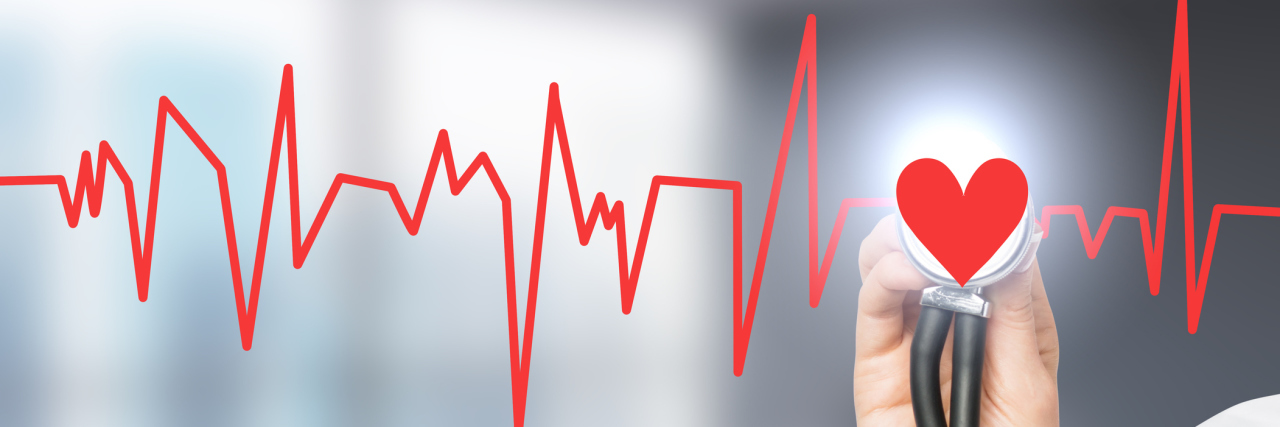 Battling Depression and Truncus Arteriosus, a Congenital Heart Defect hand listening to a red heartbeat with a stethoscope