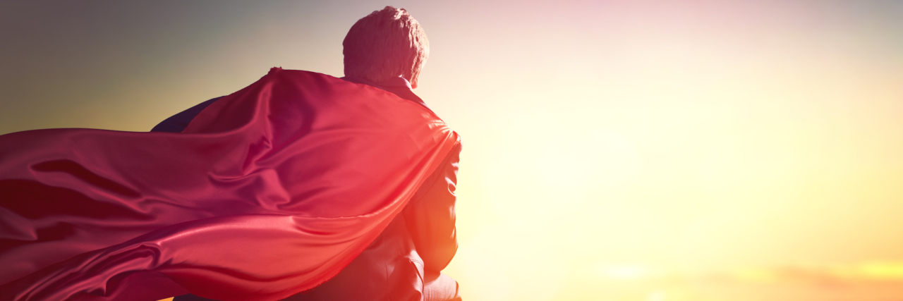 Remembering My Father (My Superman) a Year After Losing Him to Cancer superhero businessman looking at city