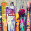 Row of artist paint brushes closeup on old wooden background.
