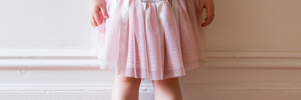 To the Little Girl in Pretty Pink Dresses With Depression Toddler in pink tutu and ballet shoes standing in vintage hallway (cropped)