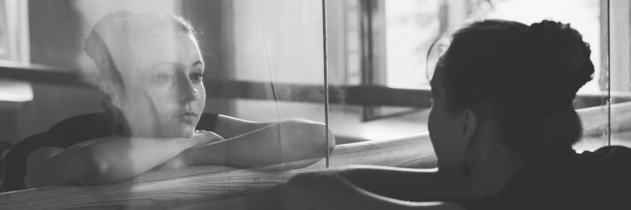 Finding Who I Was Meant to Be as a Person With a Disability Woman posing in front of the mirror.