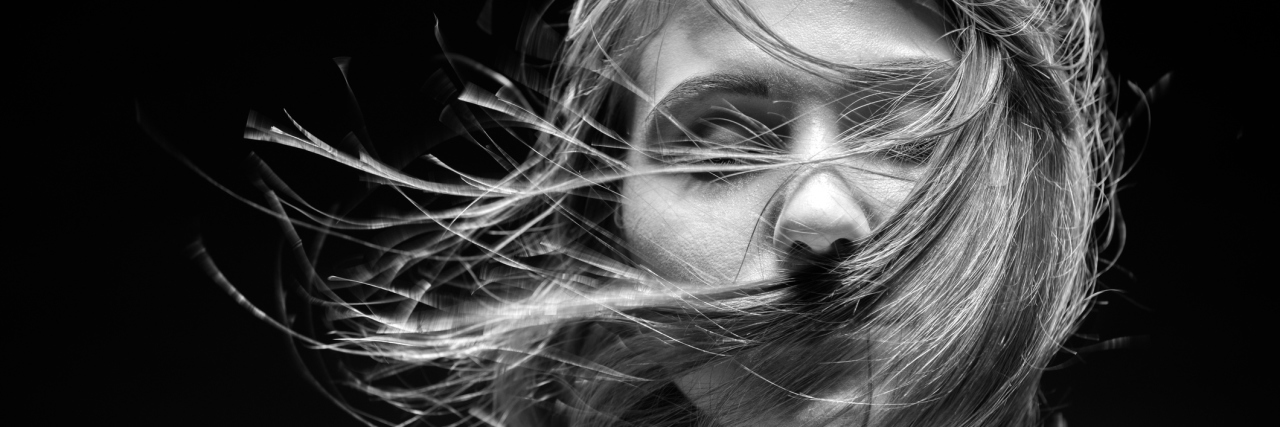 How I’m Overcoming My Need to Run in Eating Disorder Recovery Face of a woman closeup photo in studio