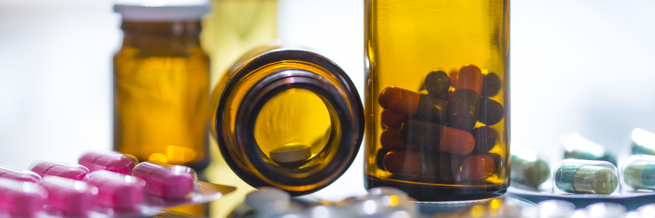 Lupus: Dealing With Harmful Side Effects of Lifesaving Medication medication in glass pill bottles