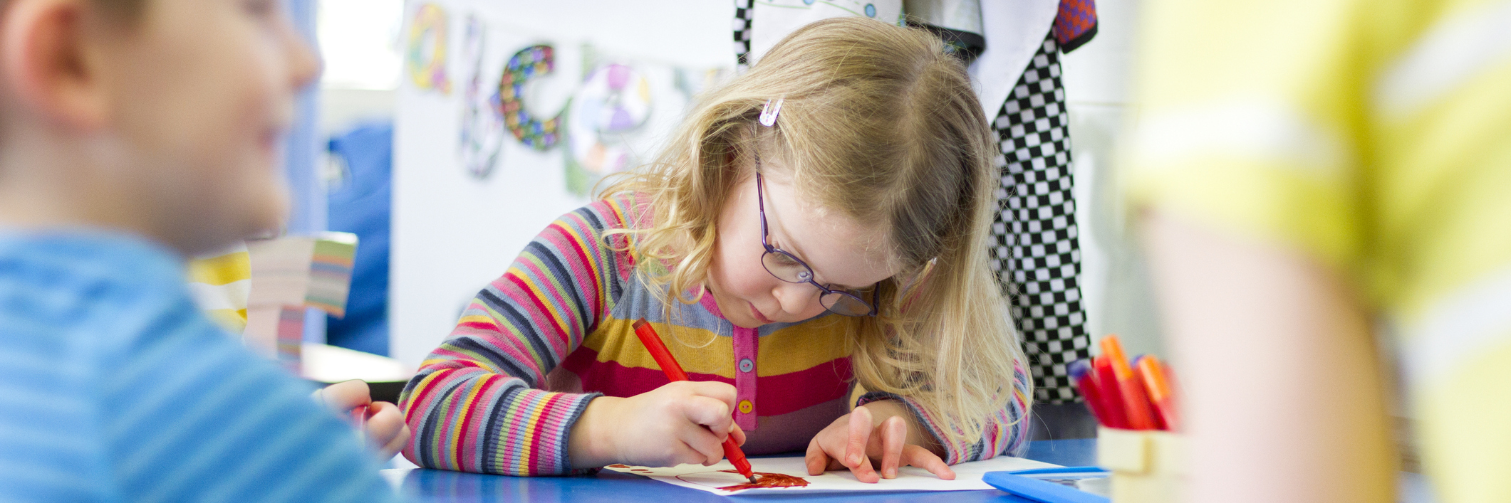 Girl writing in school.