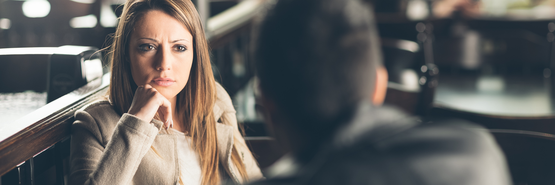 Dating With Depression: A Male Perspective on Rejection man and woman at bar with woman looking stern at man
