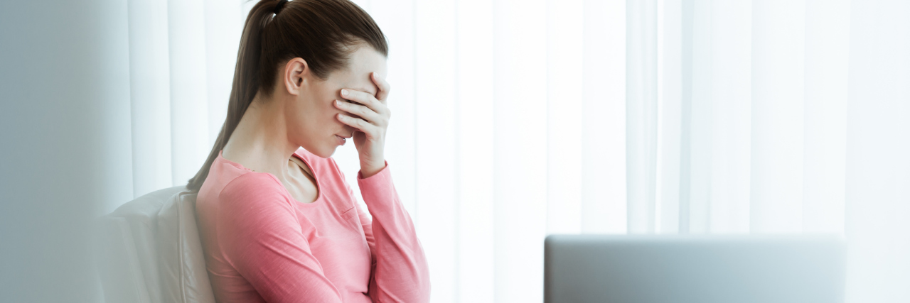 upset stressed businesswoman in office