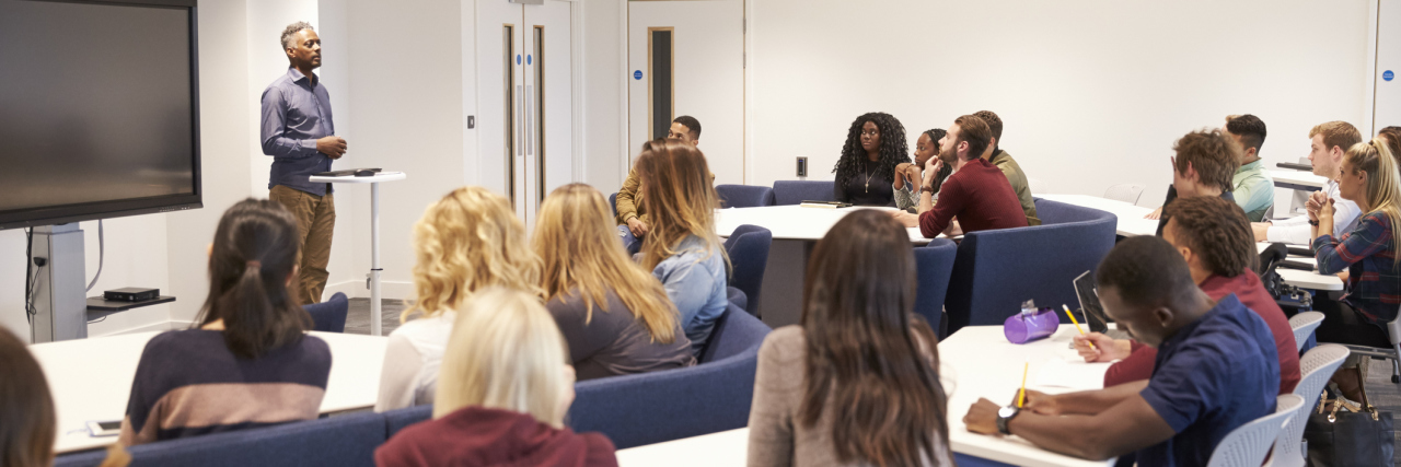 What Teachers Should Know About Students With Chronic Illness teacher lecturing to students in a classroom