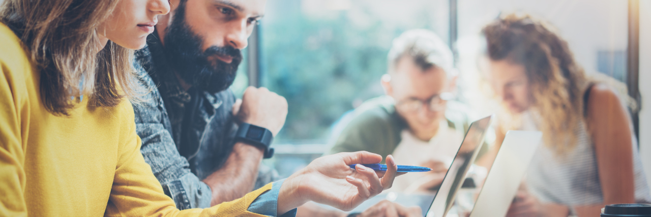 My Career Was Bad for My Mental Health Closeup Group Young Coworkers Together Discussing Creative Project During Work Process