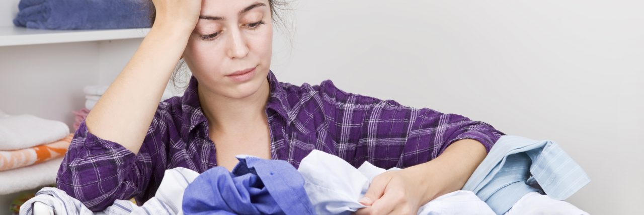 To the Mom Deciding to Seek Help for Her Postpartum Mood Disorder Frustrated young woman with basket full of clothes