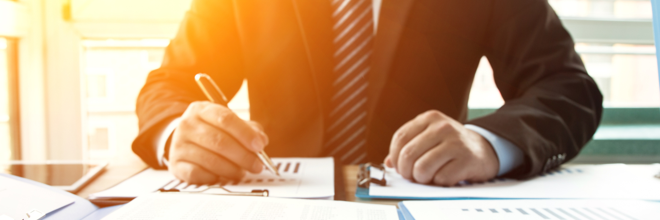 Businessman analyzing financial statements in the office