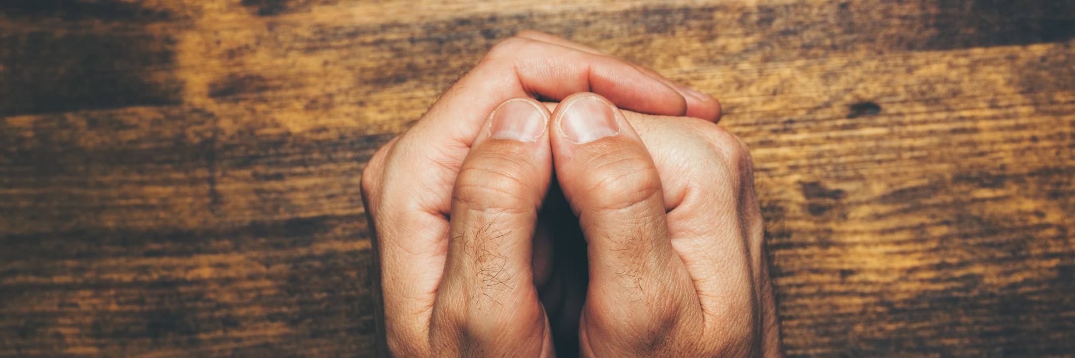 How I'm Learning to Trust God's Plan as a Man With Depression Top view of religious male crossed hands in prayer, christian religion practice