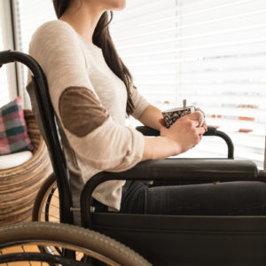 woman sitting in her wheelchair