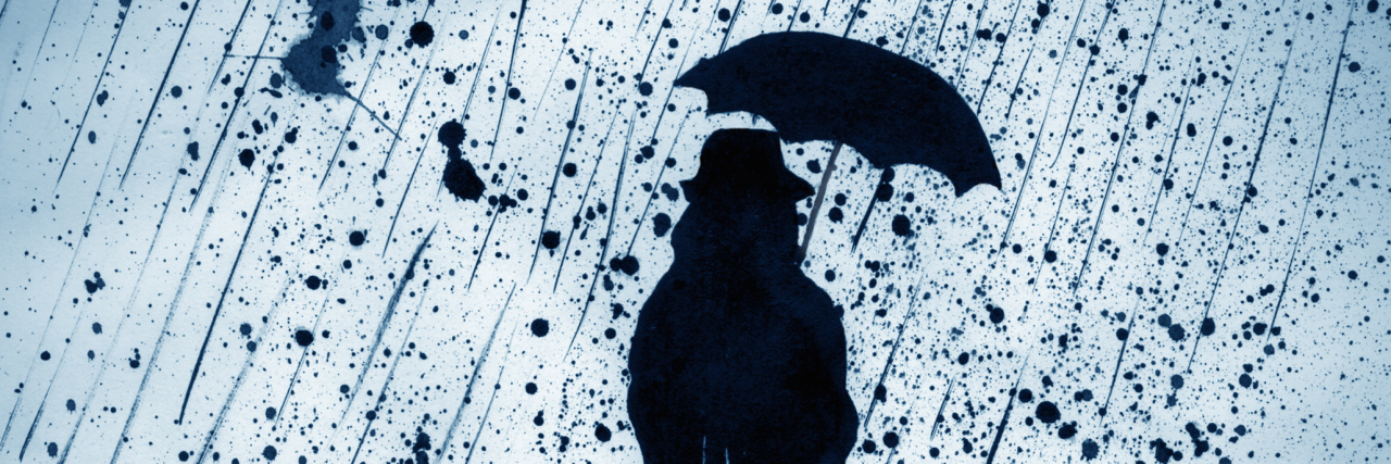 woman under heavy rain with an umbrella