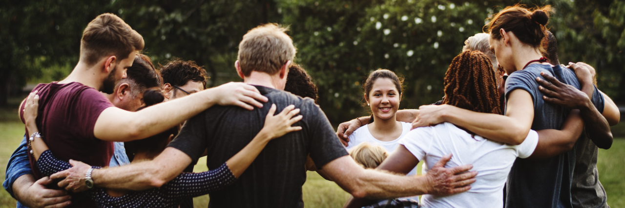 How Volunteering Helped Me Own My Anxiety Group of people huddle together in the park