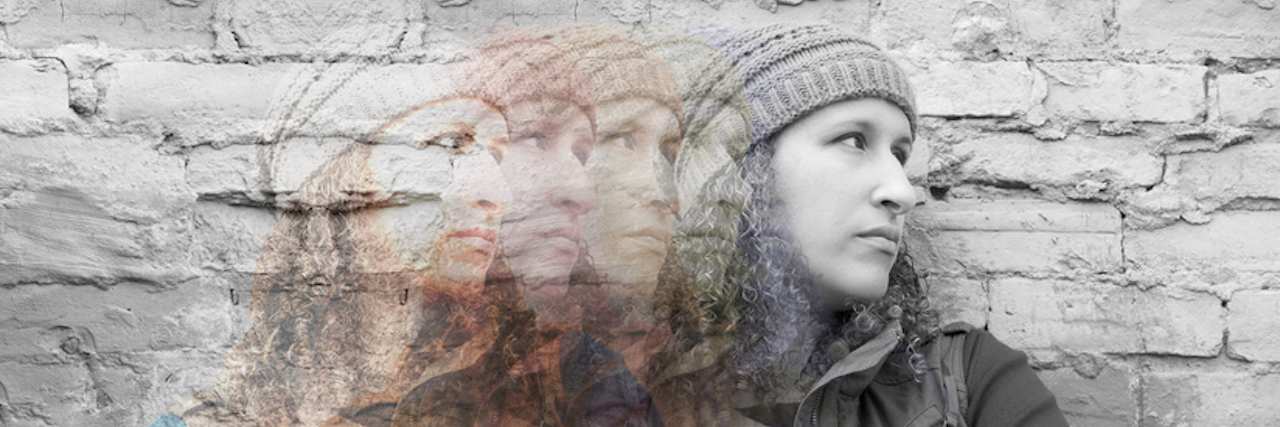 What I Learned After My First Hypomanic Episode Multiple exposures of young woman standing with crossed arms against urban wall looking away, images from color fading