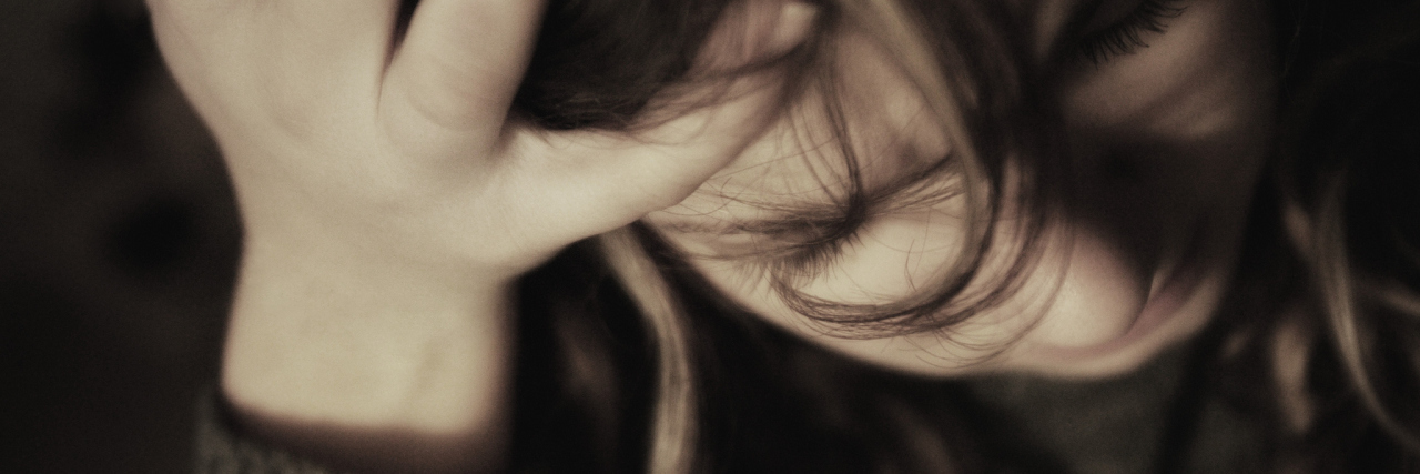 When Your Thoughts and Emotions Are Like a Tangled Box of Yarn woman with hand on head looking depressed