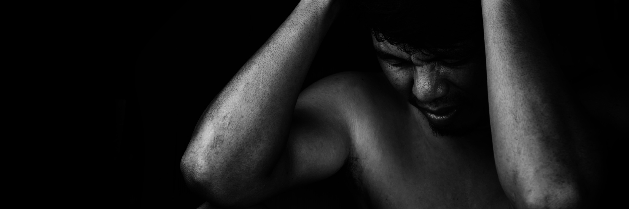 How I Struggle With My 'Potential' With Major Depressive Disorder man in darkness looking depressed