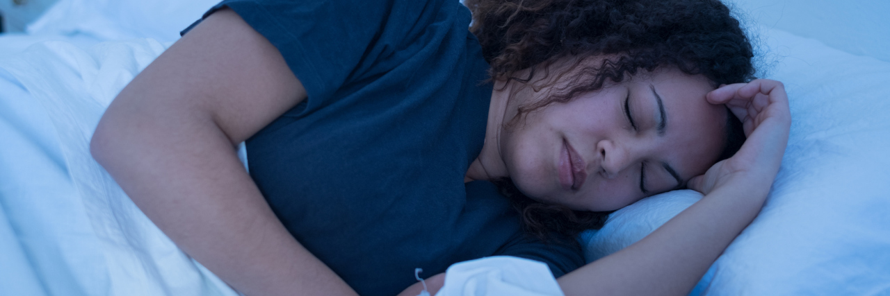 How Pompe Disease Affects My Sleep woman frowning in her sleep