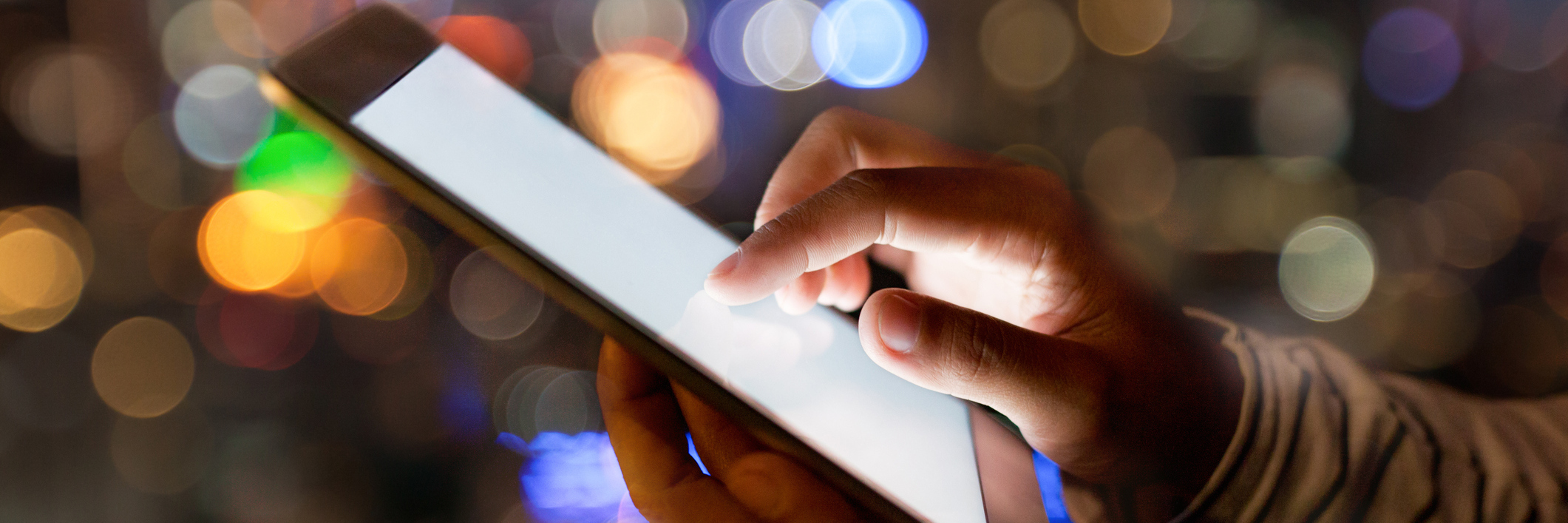 EMOJI CHECK App Is Helping Me Identify My Emotions hand using digital tablet on night beauty light bokeh in city