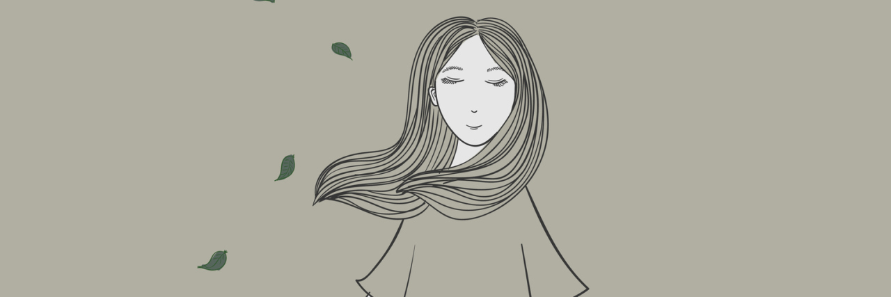 How OCD Satisfied My Desire for Control After My Dad's Death The girl stands on the stump, she is admiring the nature around her face, her smile is happy to experience nature.