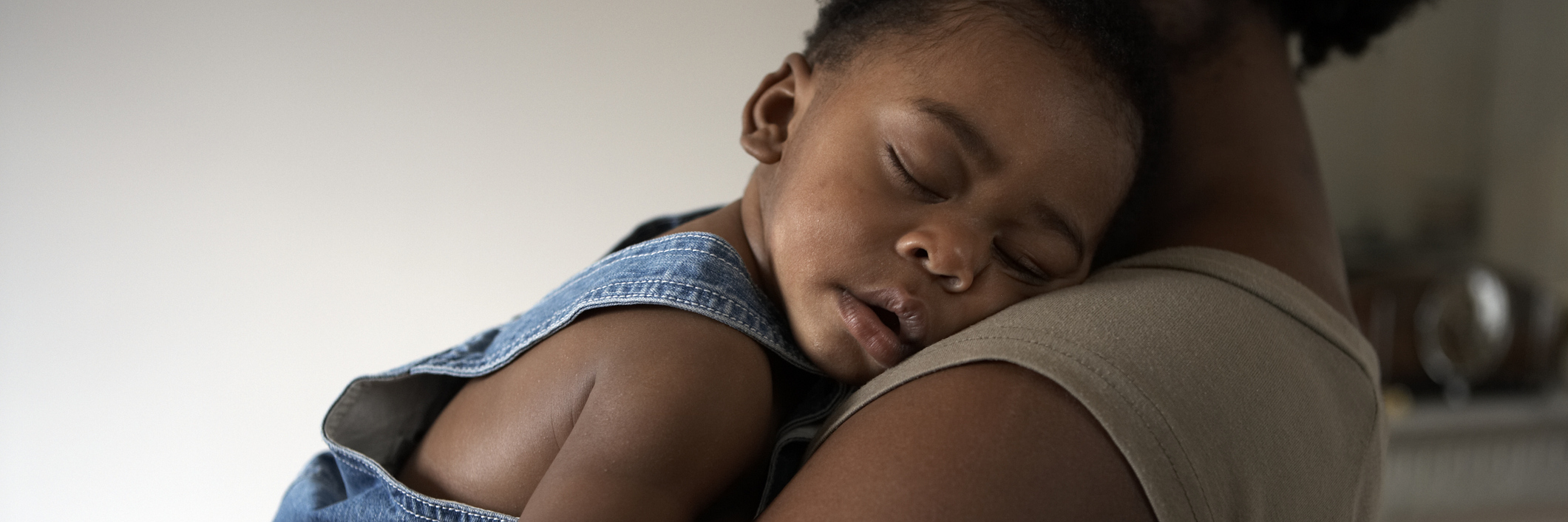 My Child Has Leukemia. Don't Say 'Let Me Know If You Need Anything.' baby asleep on mums shoulder