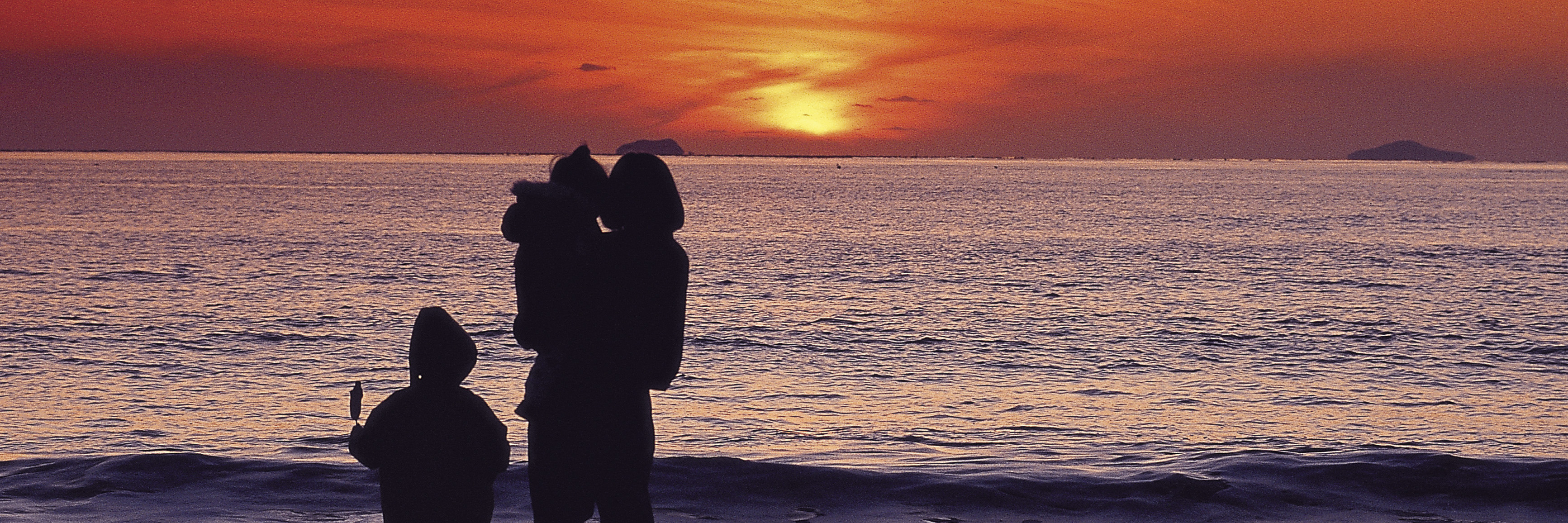 Here's Why I Choose My Words Wisely When Describing My Cancer woman with kids on beach during sunset