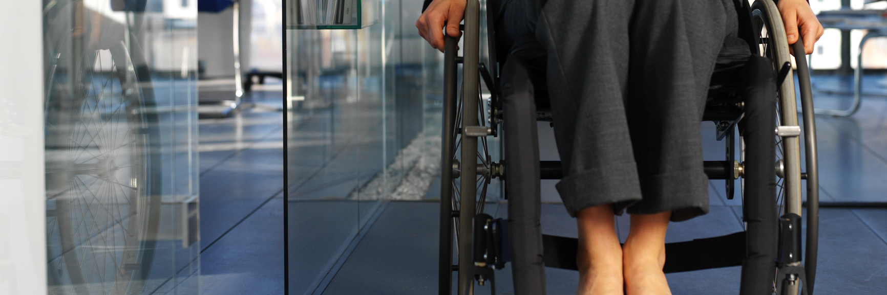 Things I'm Sick of Hearing as a Person With a Disability Businesswoman sitting in a wheelchair in an office.