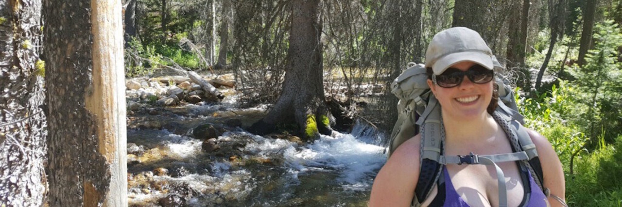 My Moment of Triumph Over Anxiety, Depression and Body Image woman hiking through the forest