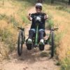 Michelle Hardy riding an adapted recumbent bike.