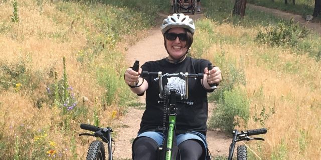What It Was Like to Try an Adaptive Handbike Michelle Hardy riding an adapted recumbent bike.