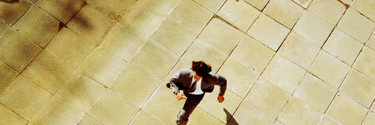 19 Secrets of People Who 'Hear Voices' A man running. Text says: 19 secrets of people who hear voices