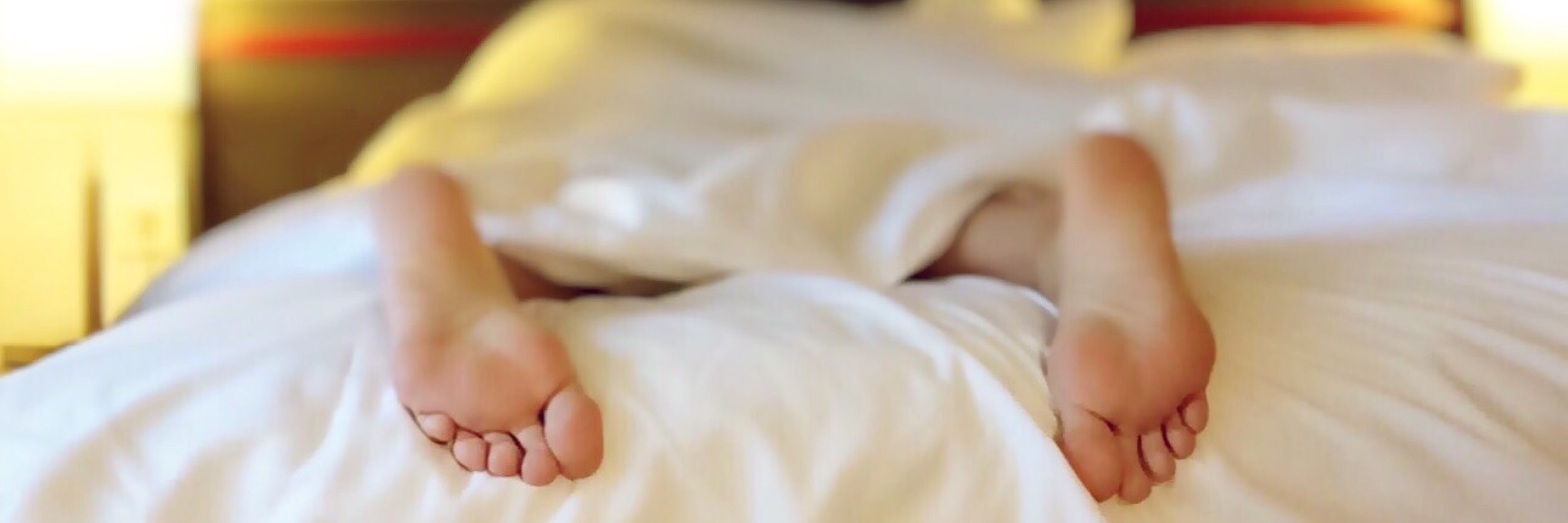 20 Things a Chronically Ill Friend Might Mean When They Say I'm Tired feet on bed sleeping