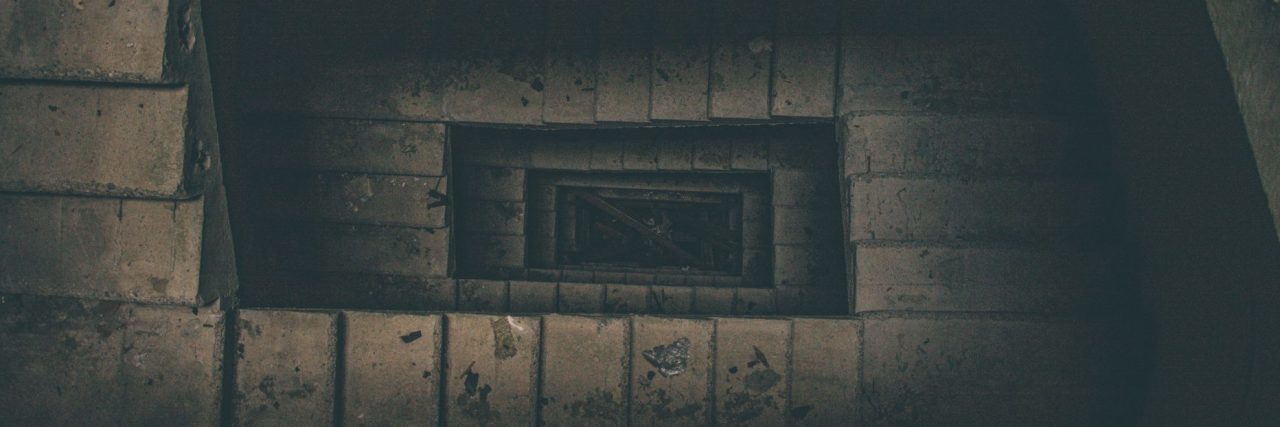 Broken Stairs: A Poem About Fighting Depression looking down old crumbling stone staircase spiral
