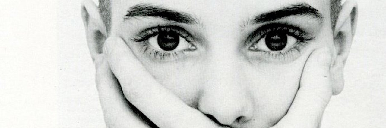 Sinead O’Connor Isn’t the Only One Struggling With Mental Illness sinead oconnor covering her mouth with her hands