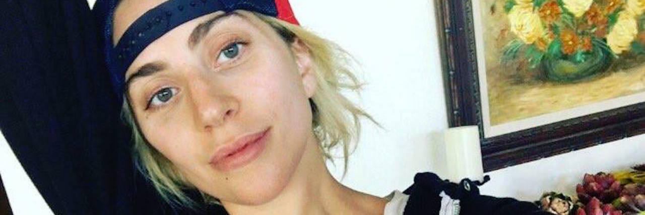 Woman With Chronic Pain Thanks Lady Gaga for Being Vulnerable lady gaga in a hoodie and baseball cap