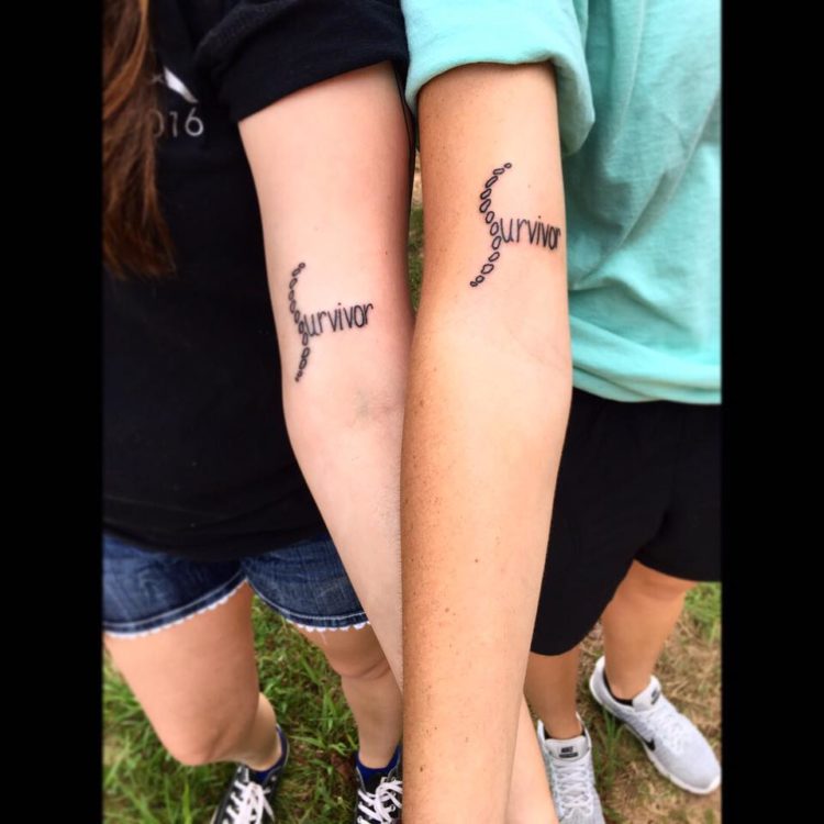 two women with matching tattoos that say 'survivor'