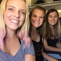 friends sitting on an airplane