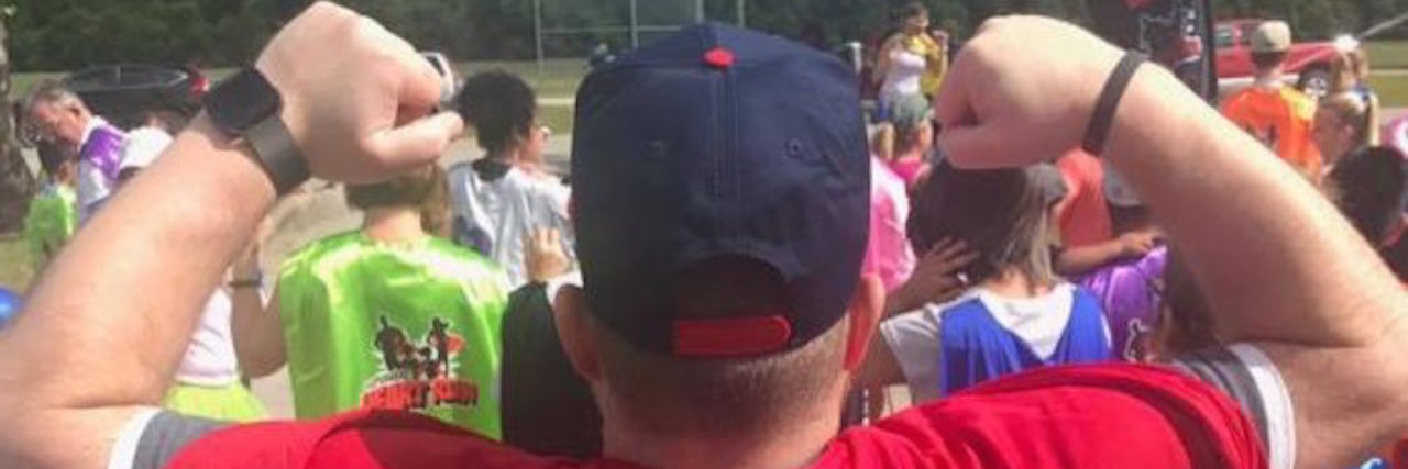 The Day You Can Start Calling Me a Congenital Heart Disease Survivor The back of the writer, picturing him with a cape that reads, "TOF strong."